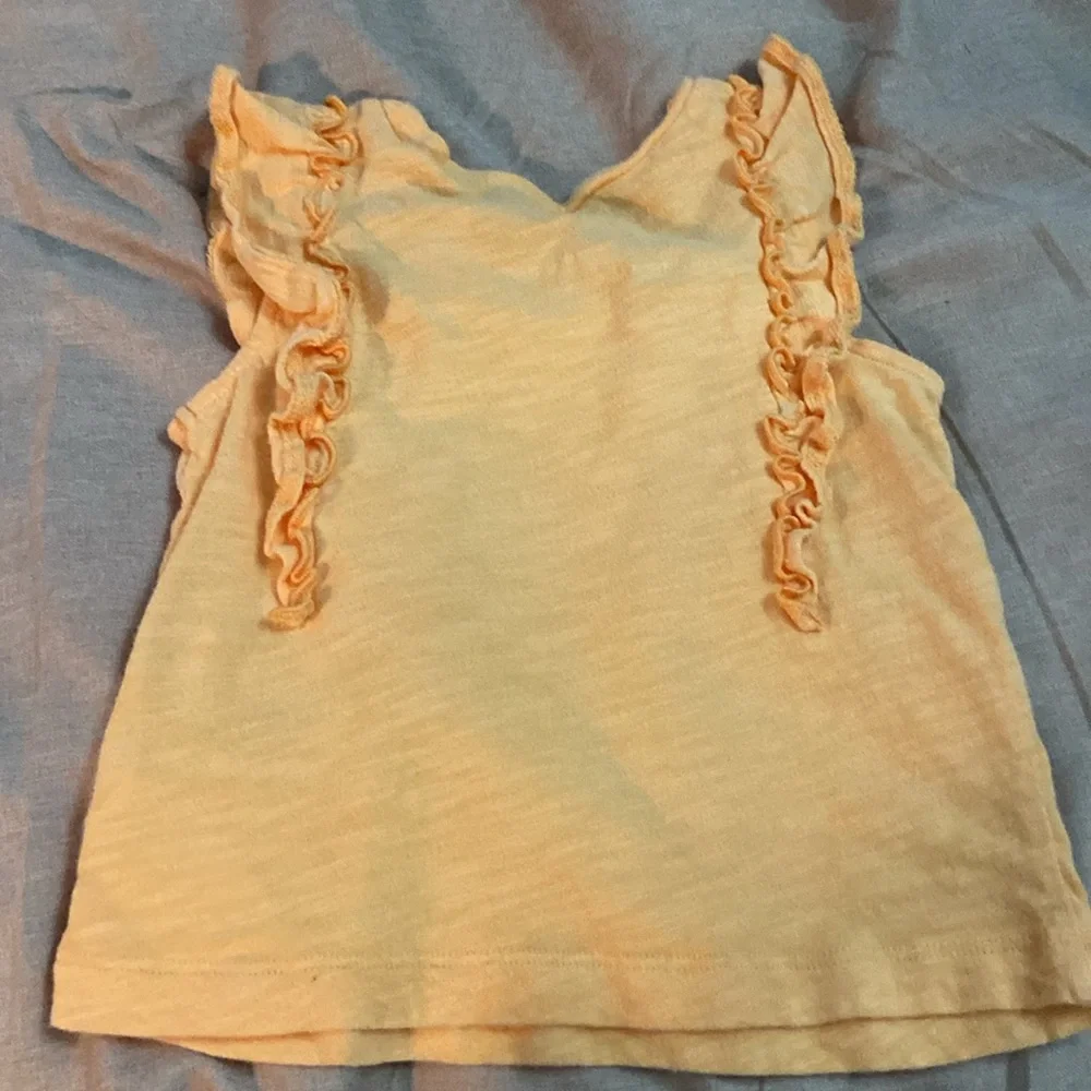 2 sleeveless shirts